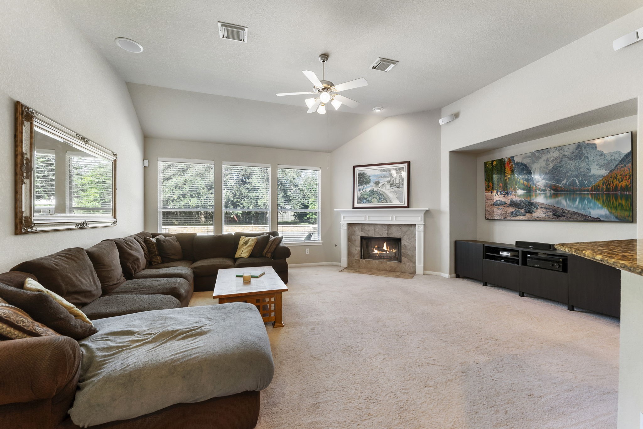 19223 Senterra Lakes Boulevard Spring, TX 77379 - Photo 20 of 48 a living room with furniture and a fireplace