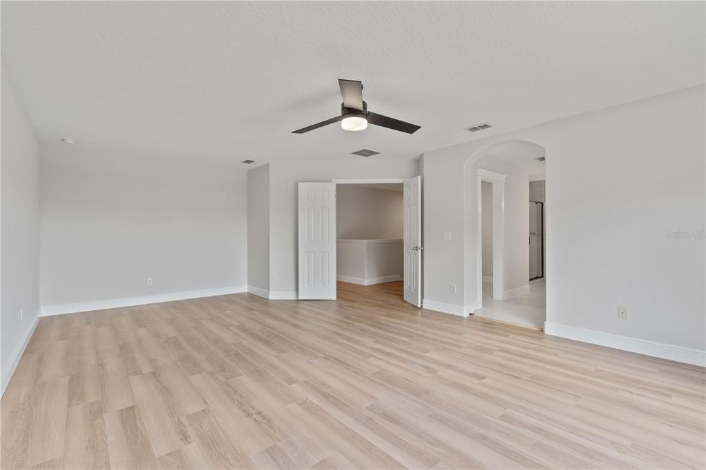 3333 Atmore Terrace Ocoee, FL 34761 - Photo 19 of 37 a view of an empty room with a ceiling fan window and a ceiling fan