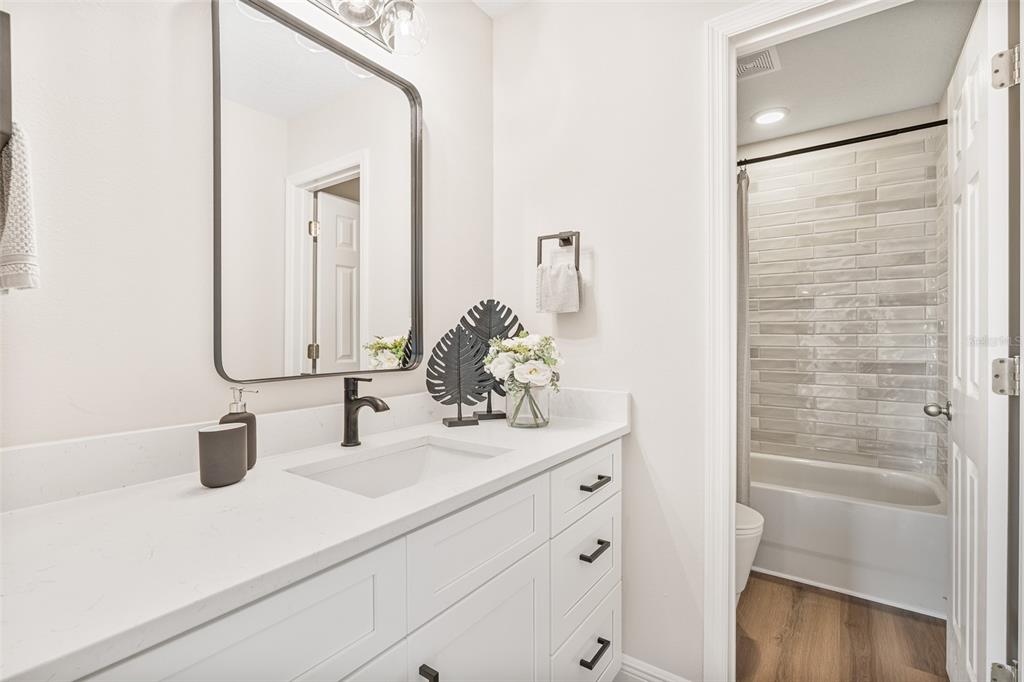 3333 Atmore Terrace Ocoee, FL 34761 - Photo 21 of 37 a bathroom with a sink and a mirror