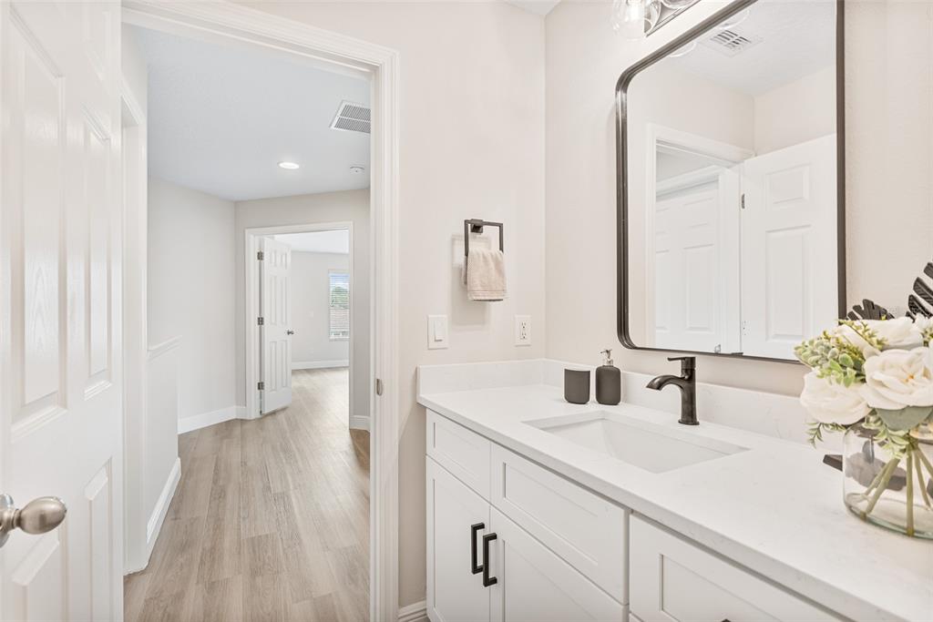 3333 Atmore Terrace Ocoee, FL 34761 - Photo 22 of 37 a bathroom with a sink and a mirror