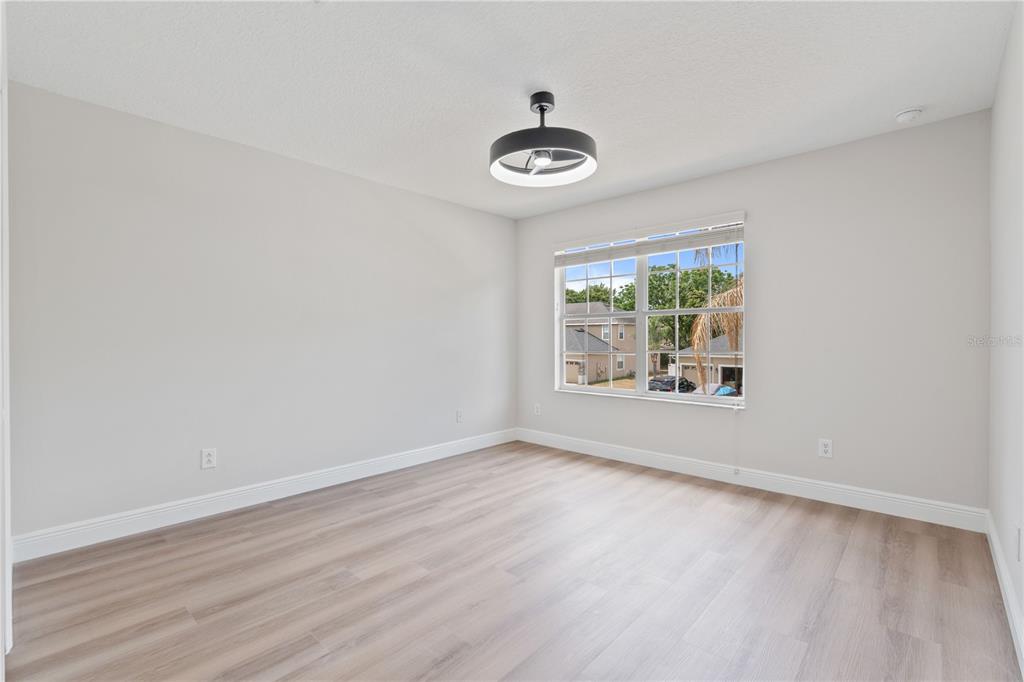 3333 Atmore Terrace Ocoee, FL 34761 - Photo 24 of 37 wooden floor in an empty room with a window