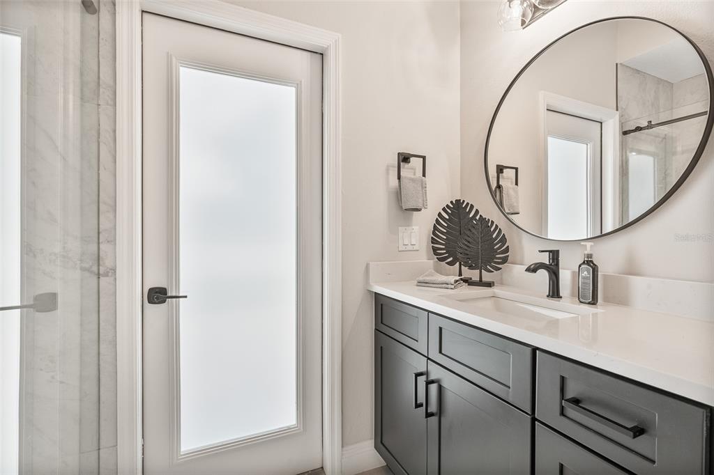 3333 Atmore Terrace Ocoee, FL 34761 - Photo 25 of 37 a bathroom with a sink vanity and a mirror