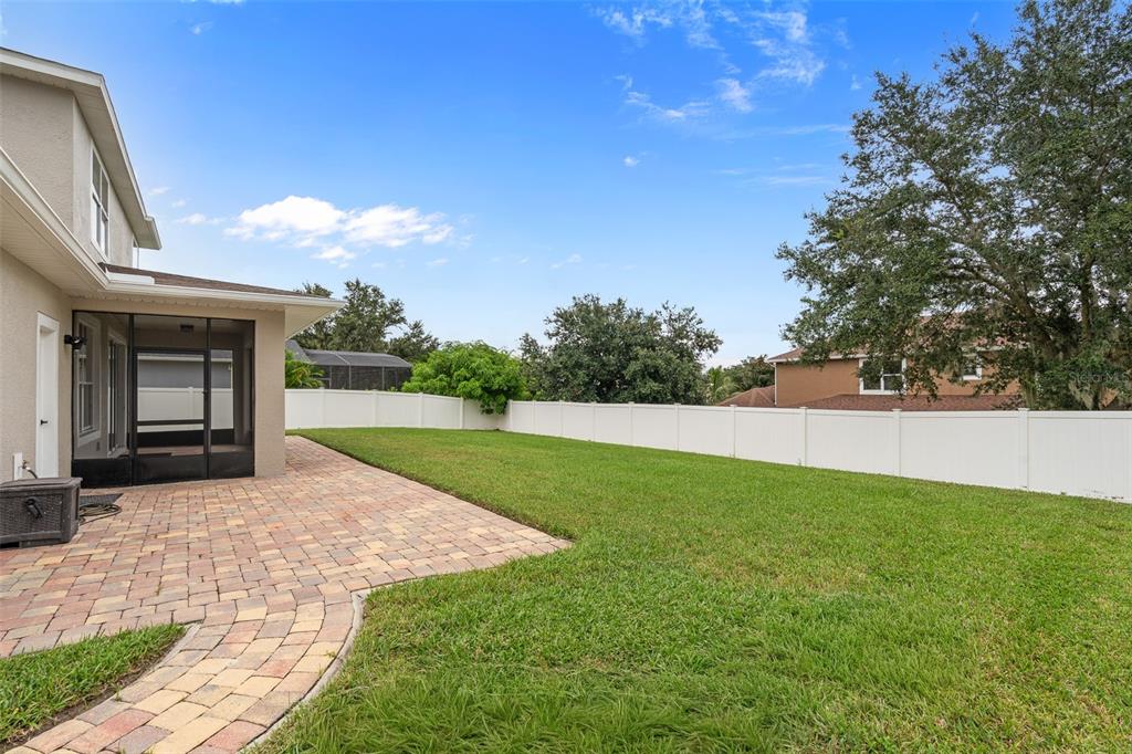3333 Atmore Terrace Ocoee, FL 34761 - Photo 29 of 37 a view of backyard with trampoline