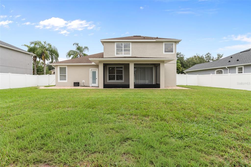 3333 Atmore Terrace Ocoee, FL 34761 - Photo 30 of 37 a view of a yard in front of a house with plants