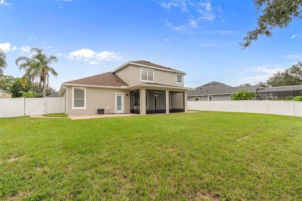 3333 Atmore Terrace Ocoee, FL 34761 - Photo 31 of 37 a front view of a house with a garden