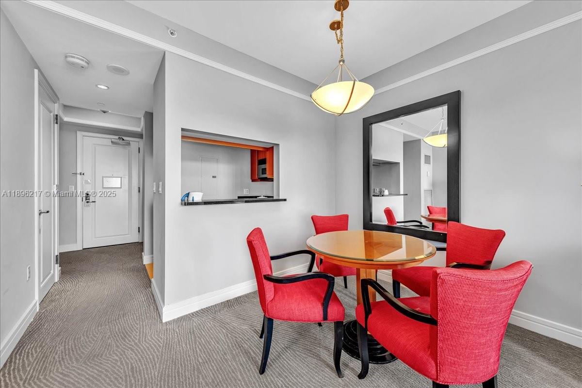 1435 Brickell Avenue, Unit 3603 Miami, FL 33131 - Photo 12 of 26 a dining room with furniture and window