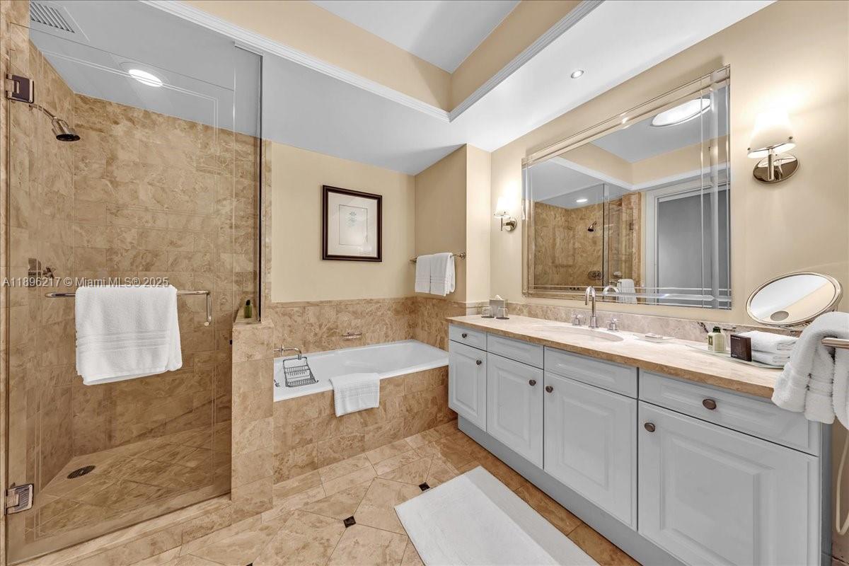 1435 Brickell Avenue, Unit 3603 Miami, FL 33131 - Photo 14 of 26 a spacious bathroom with a double vanity sink mirror and shower
