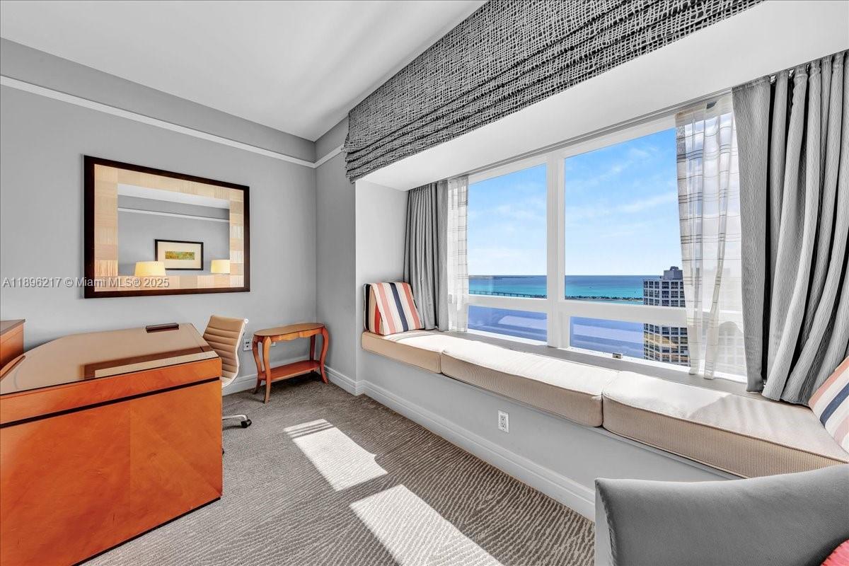 1435 Brickell Avenue, Unit 3603 Miami, FL 33131 - Photo 21 of 26 a living room with furniture and a large window