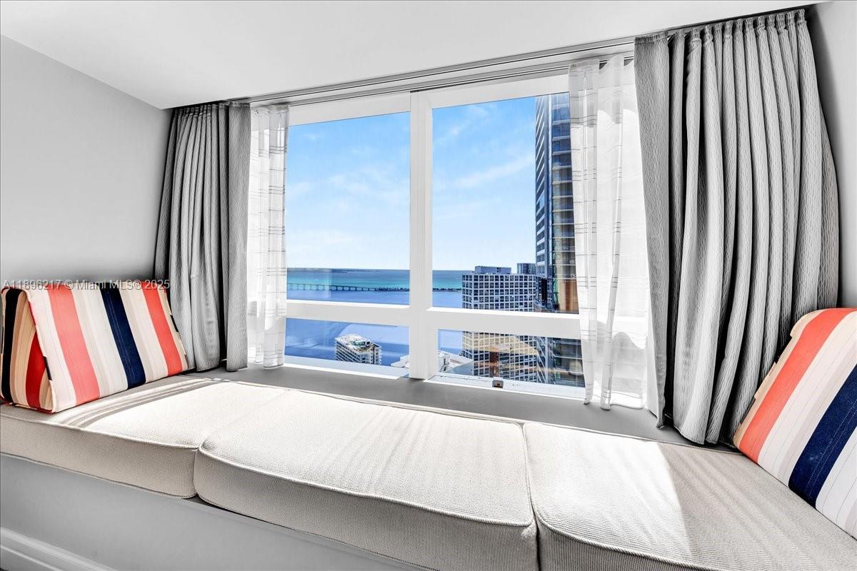 1435 Brickell Avenue, Unit 3603 Miami, FL 33131 - Photo 22 of 26 a bedroom with a bed and a large window