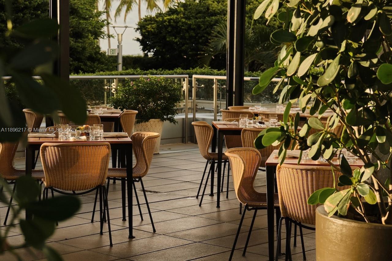 1435 Brickell Avenue, Unit 3603 Miami, FL 33131 - Photo 24 of 26 a view of a dining tables and chairs in patio