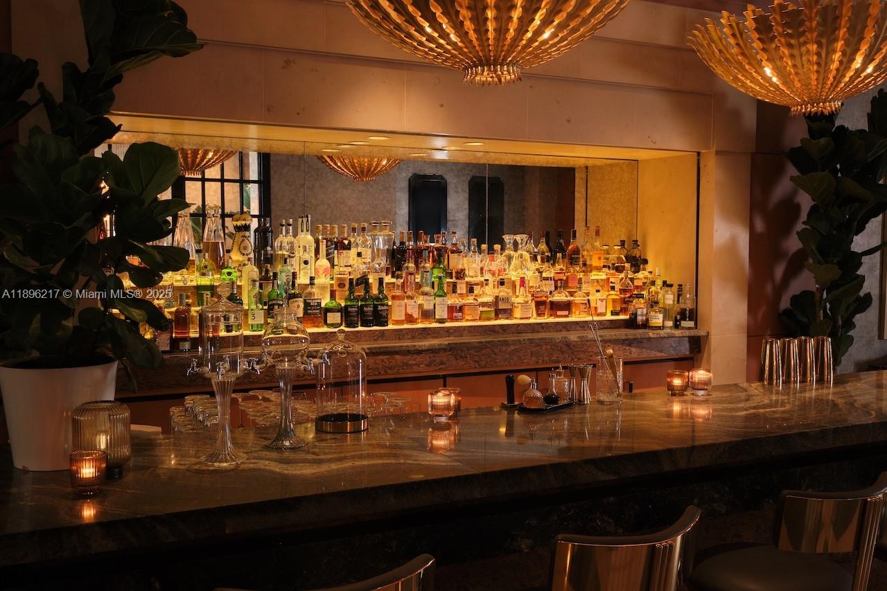 1435 Brickell Avenue, Unit 3603 Miami, FL 33131 - Photo 25 of 26 a room with table and chairs