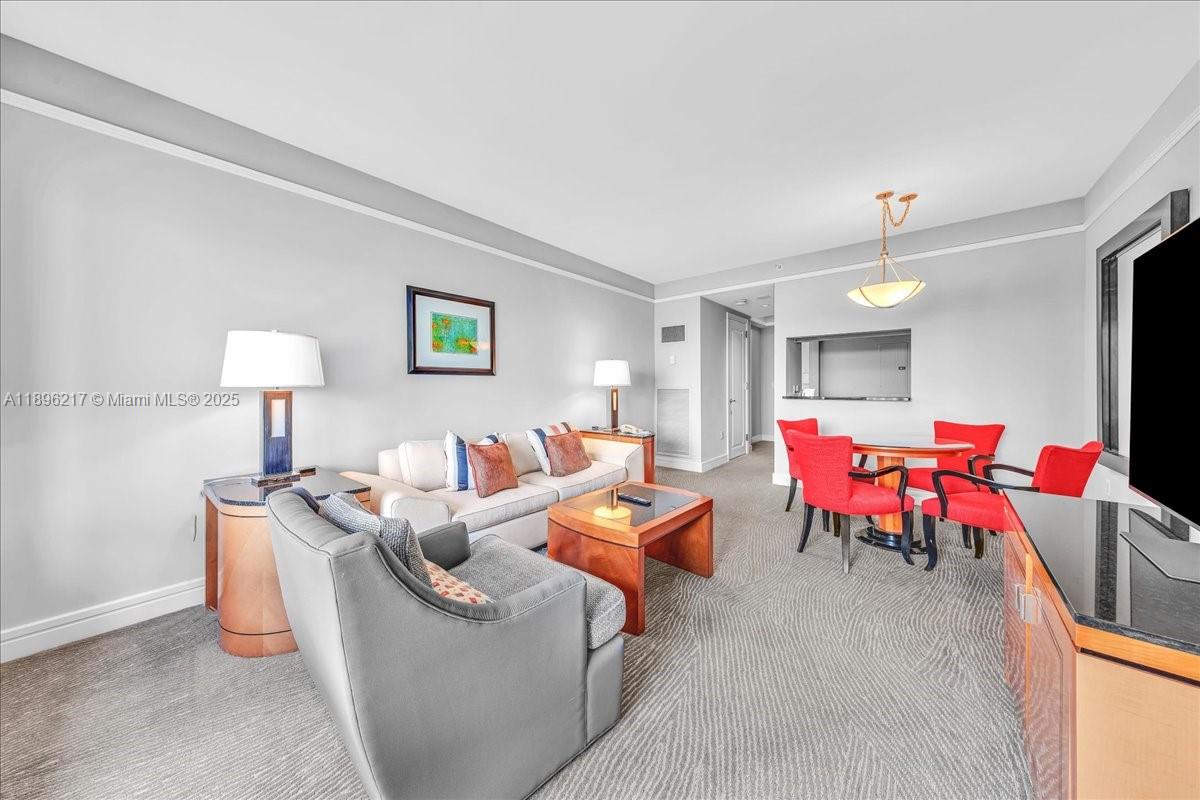 1435 Brickell Avenue, Unit 3603 Miami, FL 33131 - Photo 4 of 26 a living room with furniture and a window