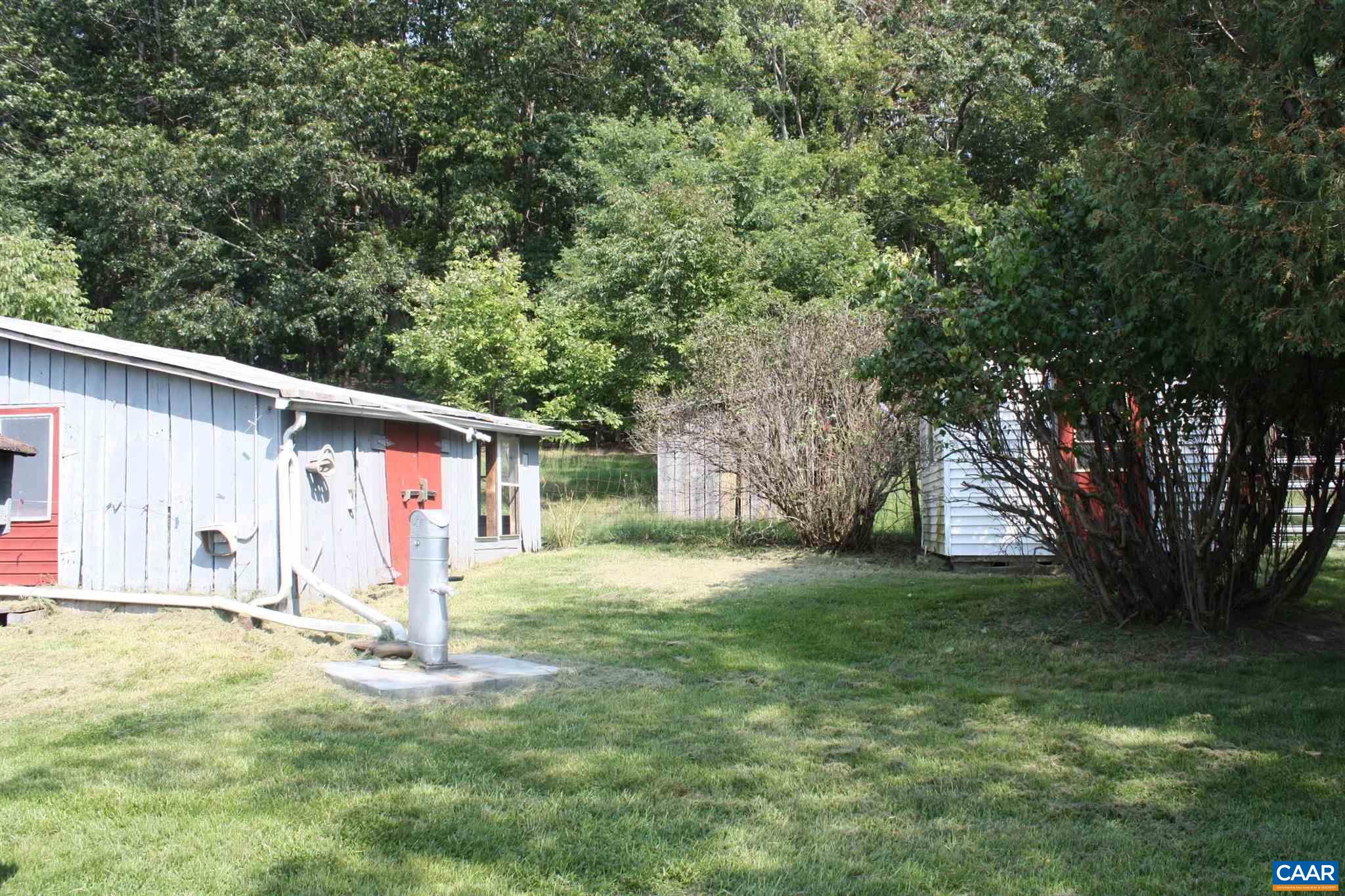 629 Carson Mill Road Steeles Tavern, VA 24476 - Photo 11 of 57 a backyard of a house with table and chairs