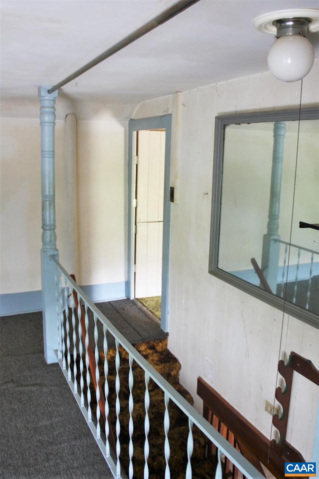 629 Carson Mill Road Steeles Tavern, VA 24476 - Photo 29 of 57 a view of a hallway with wooden floor and staircase