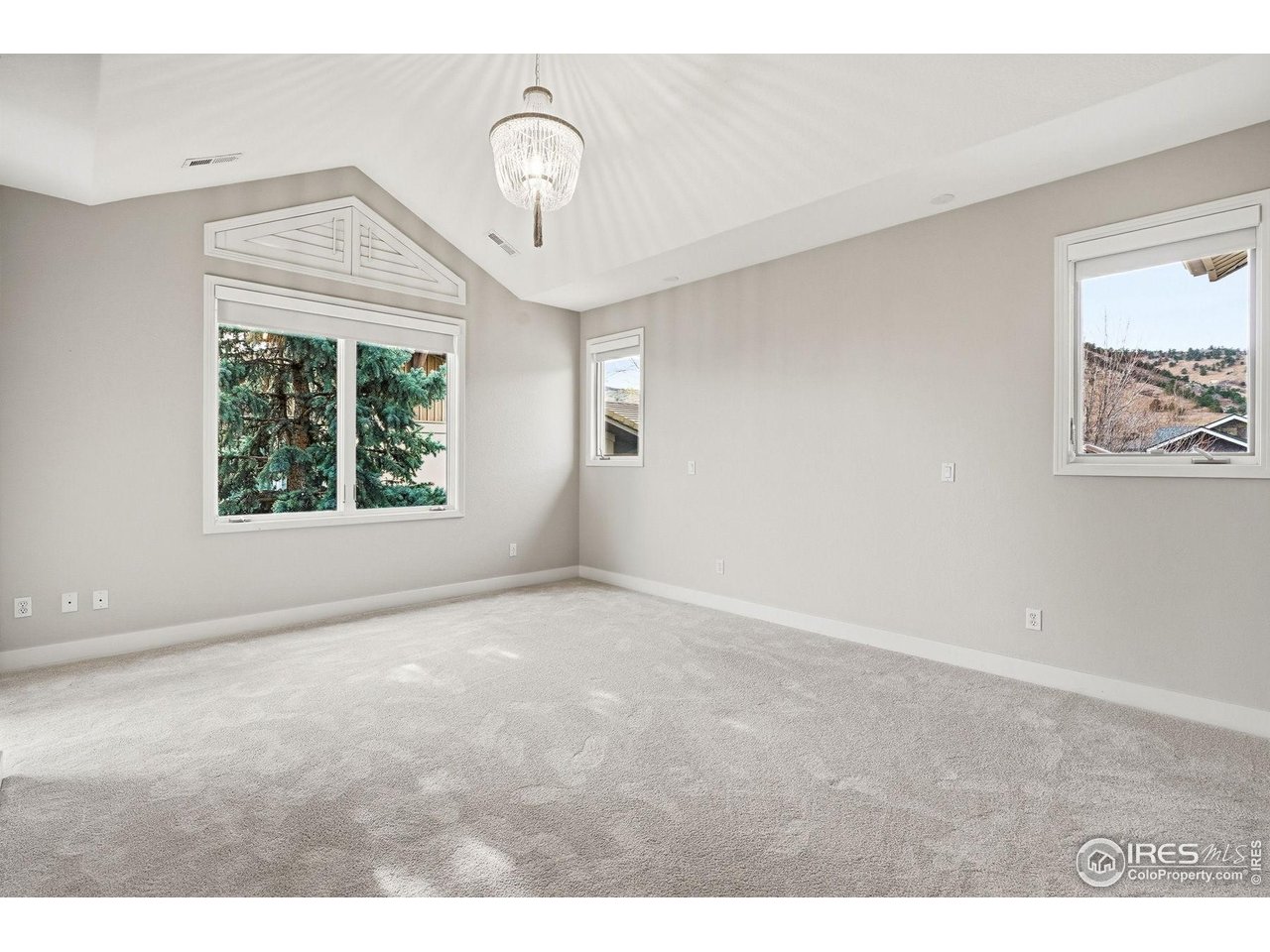 4840 6th Street Boulder, CO 80304 - Photo 25 of 43 Bedroom three has a sparkling-crystals light, vaulted ceiling, west-facing views and an east-facing balcony.