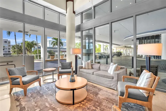 a view of a swimming pool with seating space