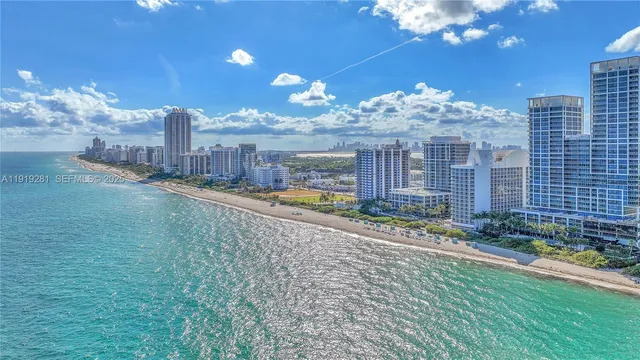 a view of a swimming pool with a yard