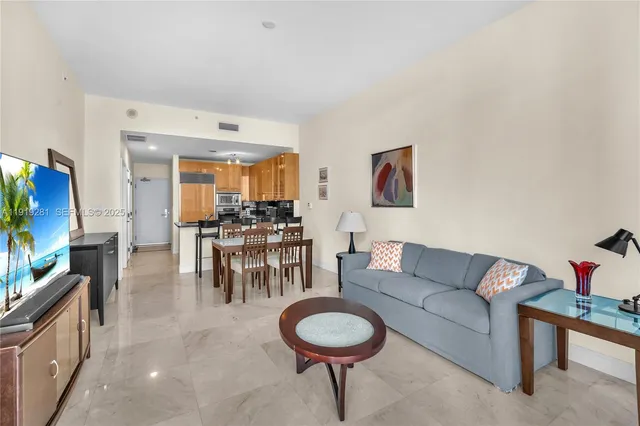 a kitchen with granite countertop a refrigerator and a stove
