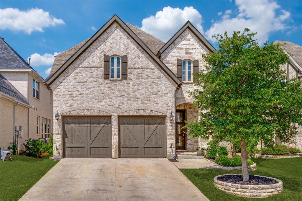 8440 Colburn The Colony, TX 75056 - Photo 1 of 34 Welcome to 8440 Colburn in The Tribute! This beautiful home offers charming curb appeal with a stunning stone and brick elevation, mature landscaping, and an inviting front entry. Enjoy The Tribute’s exceptional amenities, including resort-style pools, golf courses, walking trails, parks, playgrounds, and access to the shores of Lake Lewisville.