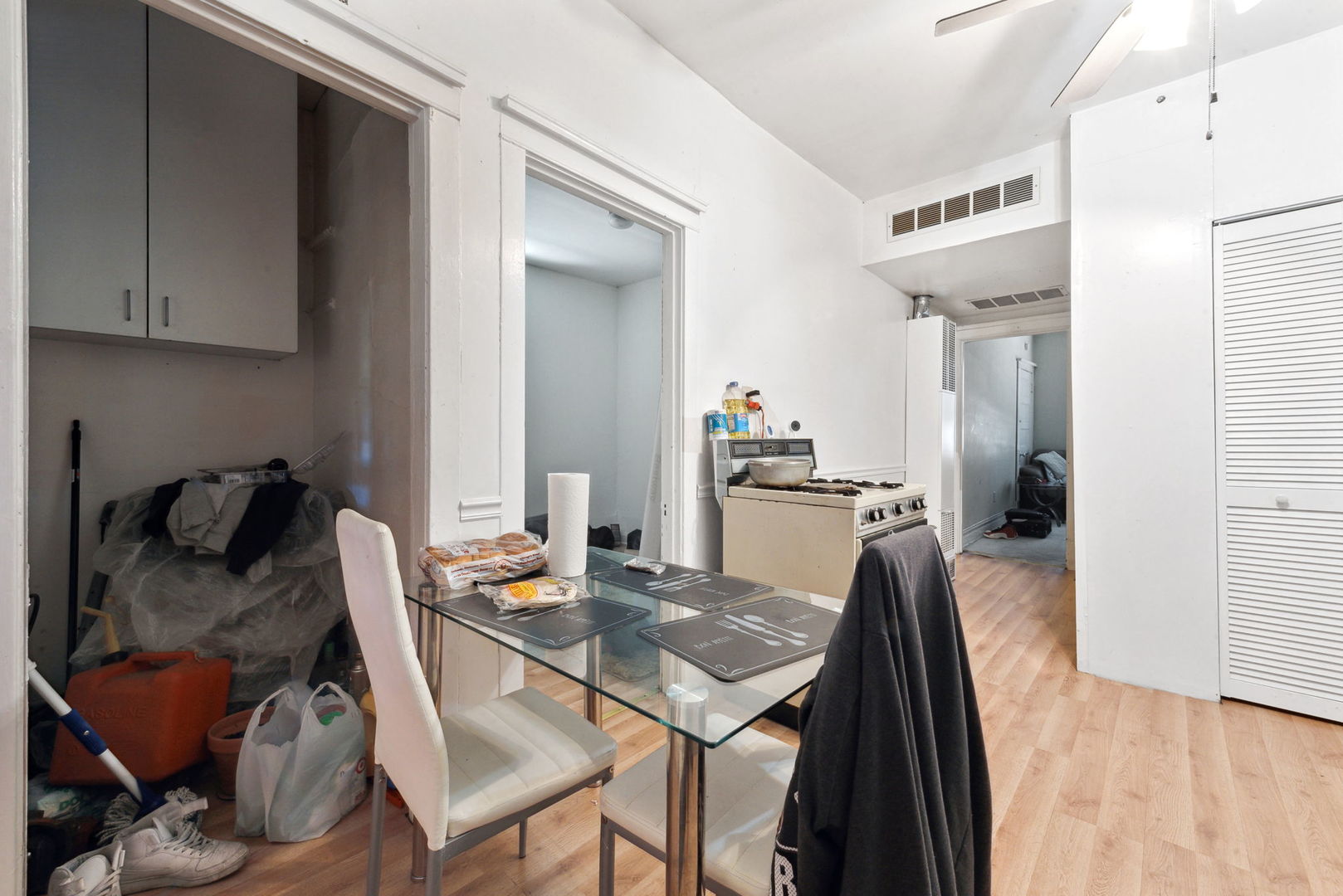 4411 West Haddon Avenue Chicago, IL 60651 - Photo 13 of 21 a view of a dining room with furniture and wooden floor