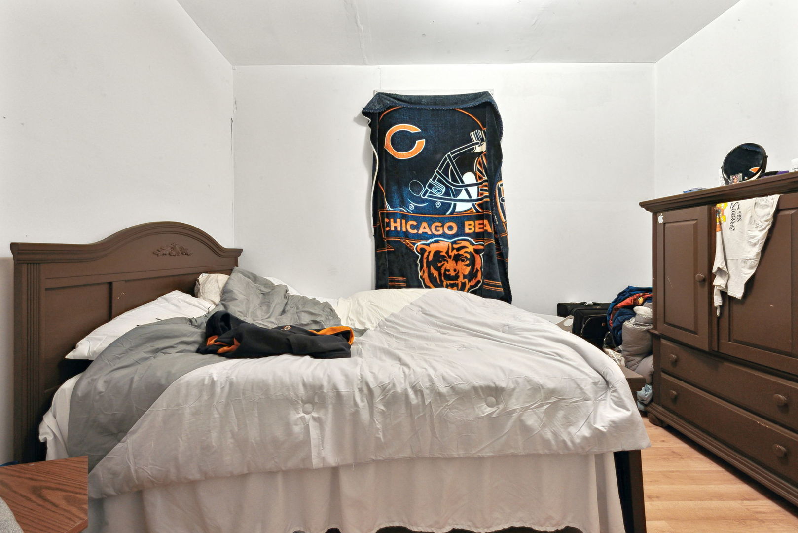 4411 West Haddon Avenue Chicago, IL 60651 - Photo 15 of 21 a bed sitting in a bedroom next to a window