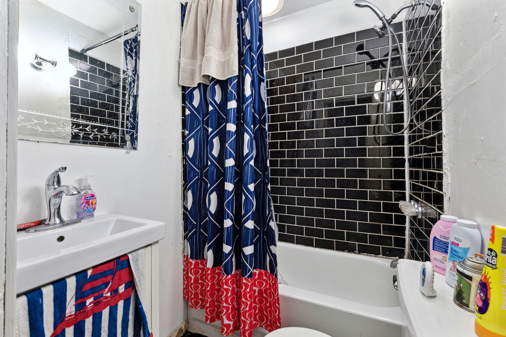 4411 West Haddon Avenue Chicago, IL 60651 - Photo 16 of 21 a bathroom with a bathtub shower sink and mirror