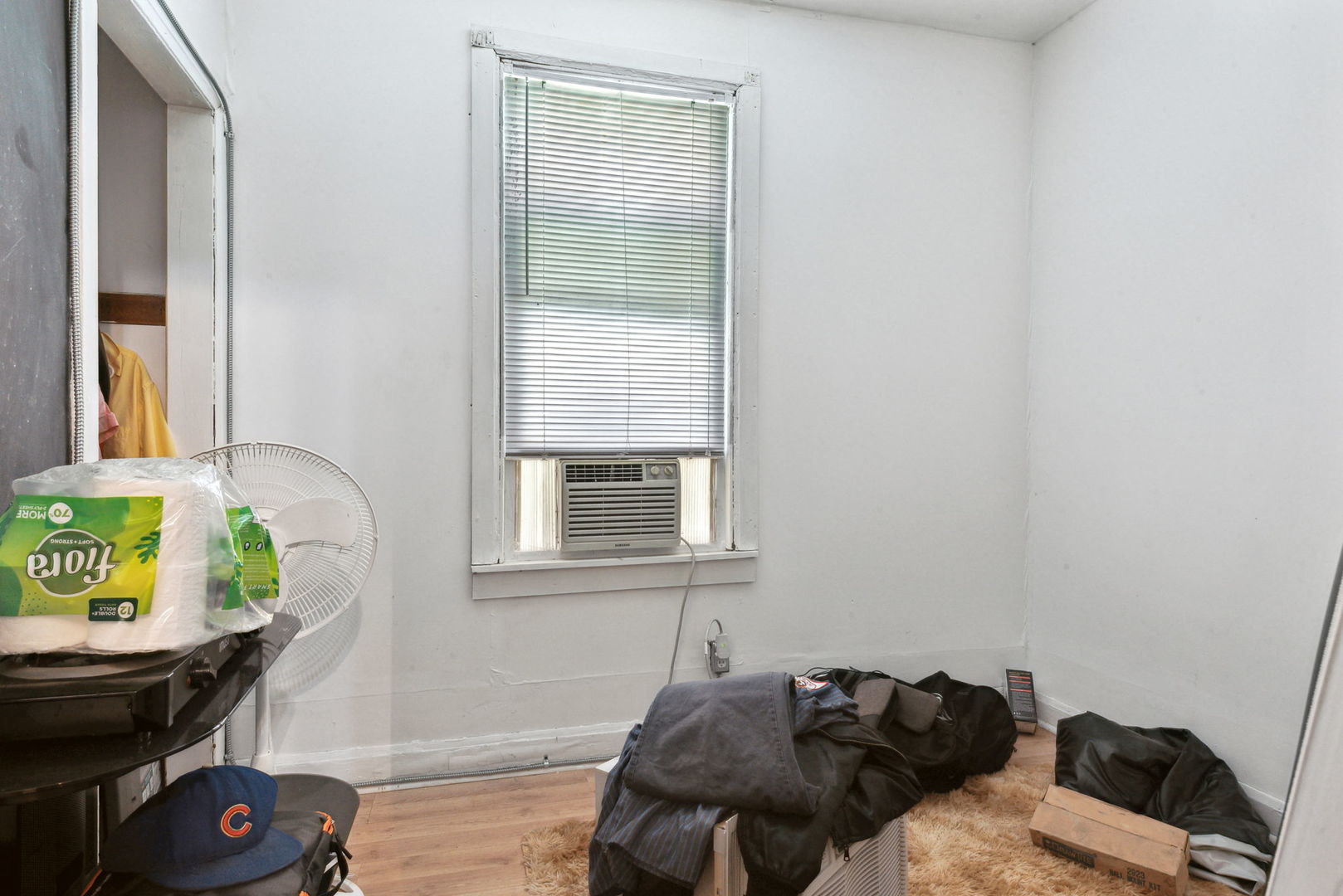 4411 West Haddon Avenue Chicago, IL 60651 - Photo 17 of 21 a bedroom with a bed and a window