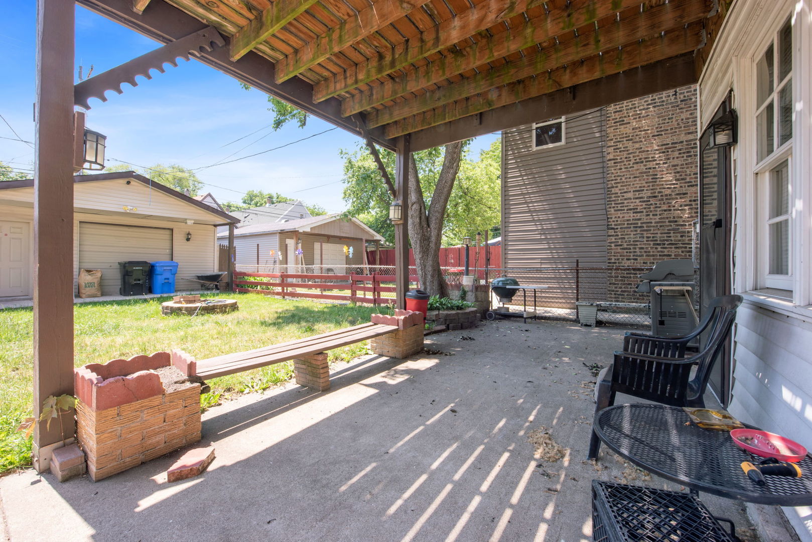 4411 West Haddon Avenue Chicago, IL 60651 - Photo 18 of 21 a view of a house with backyard and porch