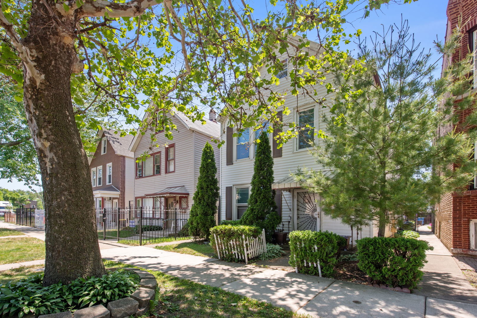 4411 West Haddon Avenue Chicago, IL 60651 - Photo 2 of 21 a front view of a house with garden