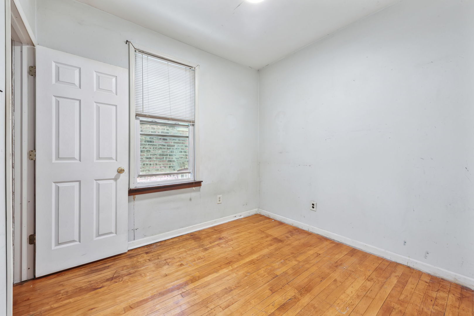 4411 West Haddon Avenue Chicago, IL 60651 - Photo 6 of 21 an empty room with a window