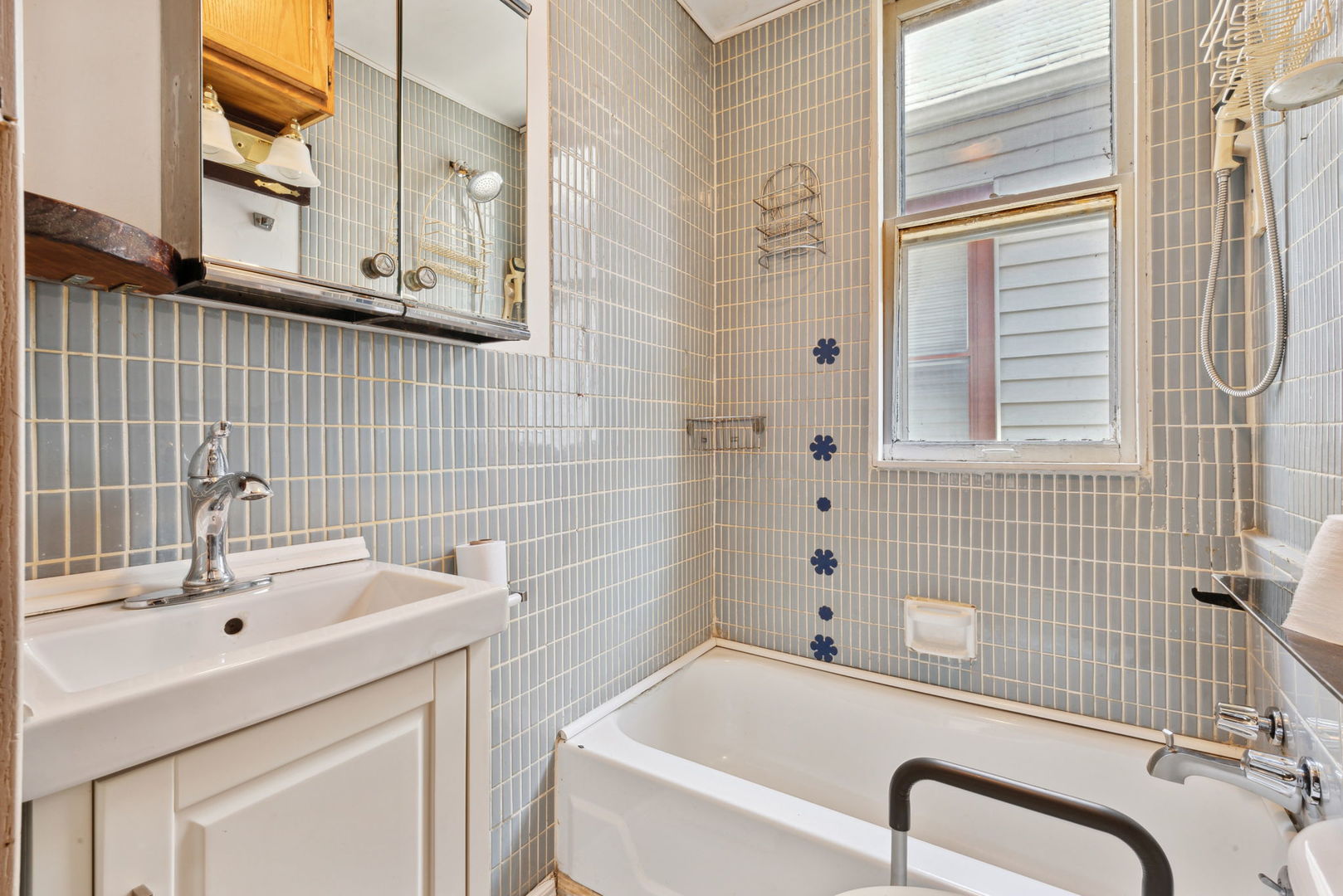 4411 West Haddon Avenue Chicago, IL 60651 - Photo 7 of 21 a bathroom with a sink and a bathtub