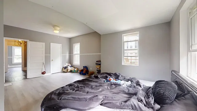 a bed room with a bed and a window