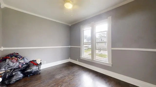 a view of a room with wooden floor and closet