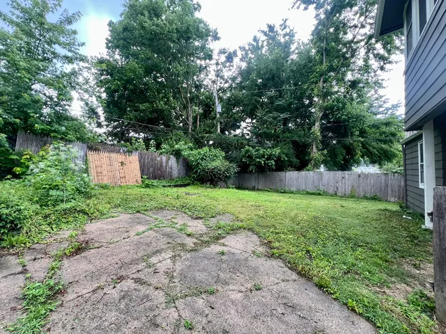 a backyard of a house with lots of green space