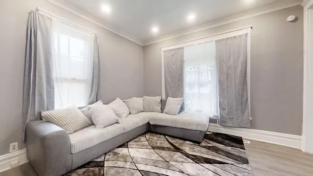a living room with furniture and a window