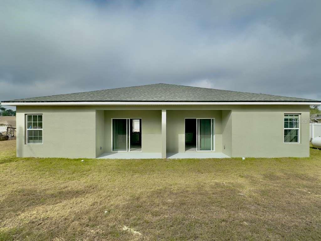 15885 Southwest 35th Court Road, Unit 1 Ocala, FL 34473 - Photo 27 of 27 front view of a house with yard