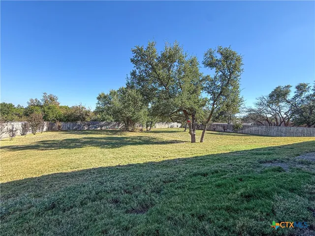 a view of a swimming pool with an outdoor space and seating area