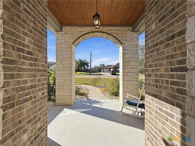 a view of a door and wooden floor