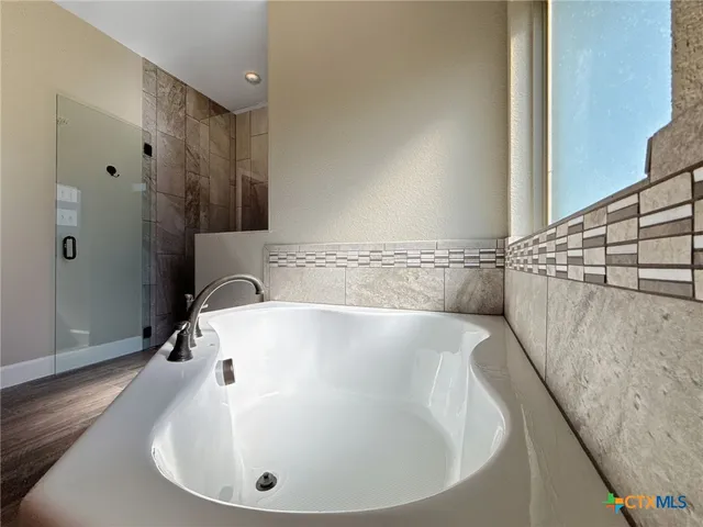 a bathroom with a white tub