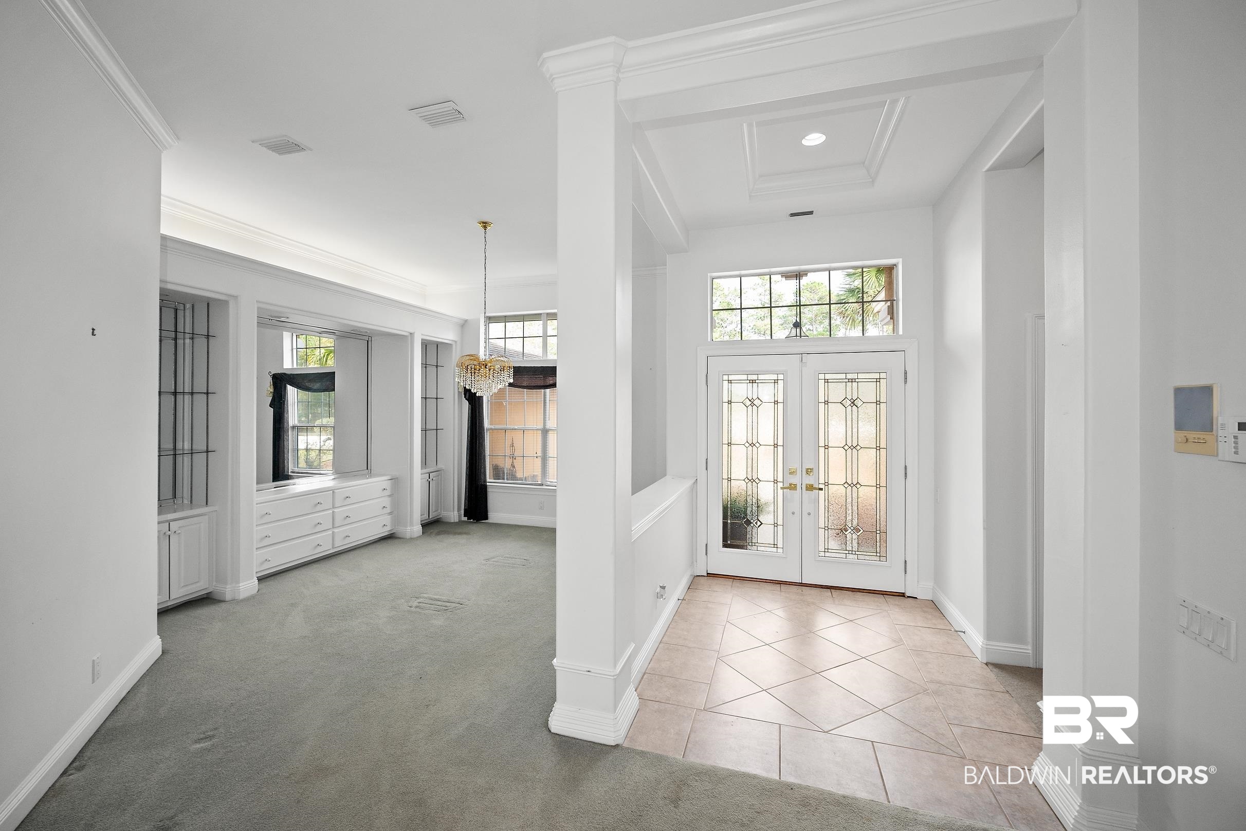 8591 Bay Harbor Road Elberta, AL 36530 - Photo 23 of 56 Entrance foyer with light carpet, french doors, and light tile patterned floors
