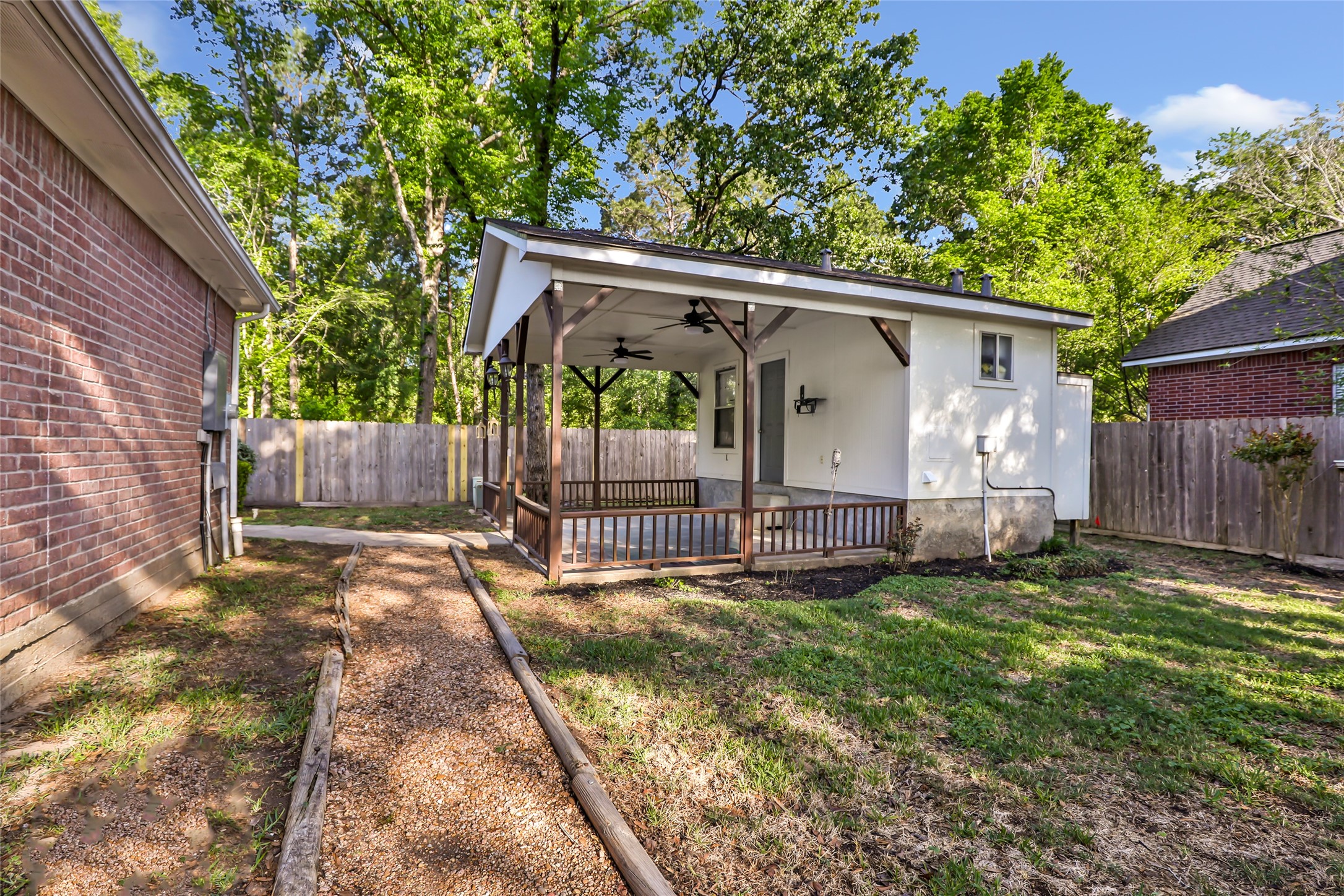 1014 North Rivershire Drive Conroe, TX 77304 - Photo 13 of 37 a view of a barn in the back yard