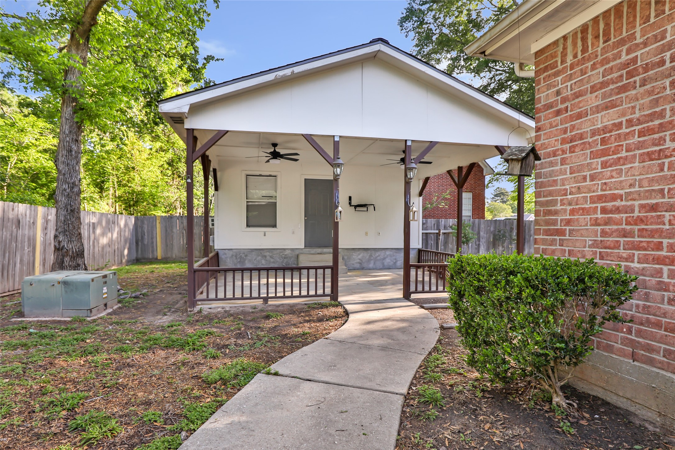 1014 North Rivershire Drive Conroe, TX 77304 - Photo 14 of 37 a front view of a house with garden