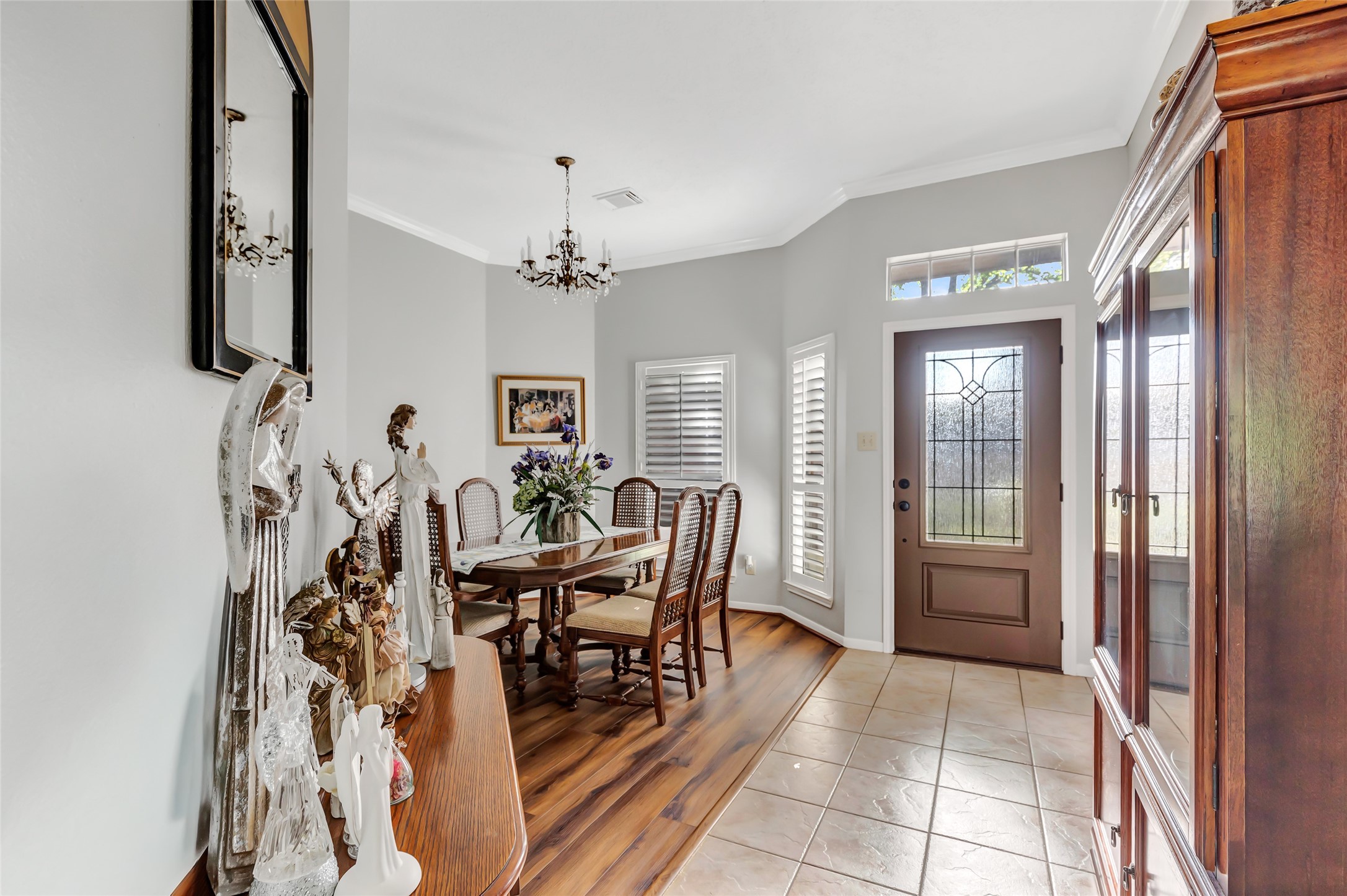 1014 North Rivershire Drive Conroe, TX 77304 - Photo 19 of 37 a view of a dining room with furniture and chandelier
