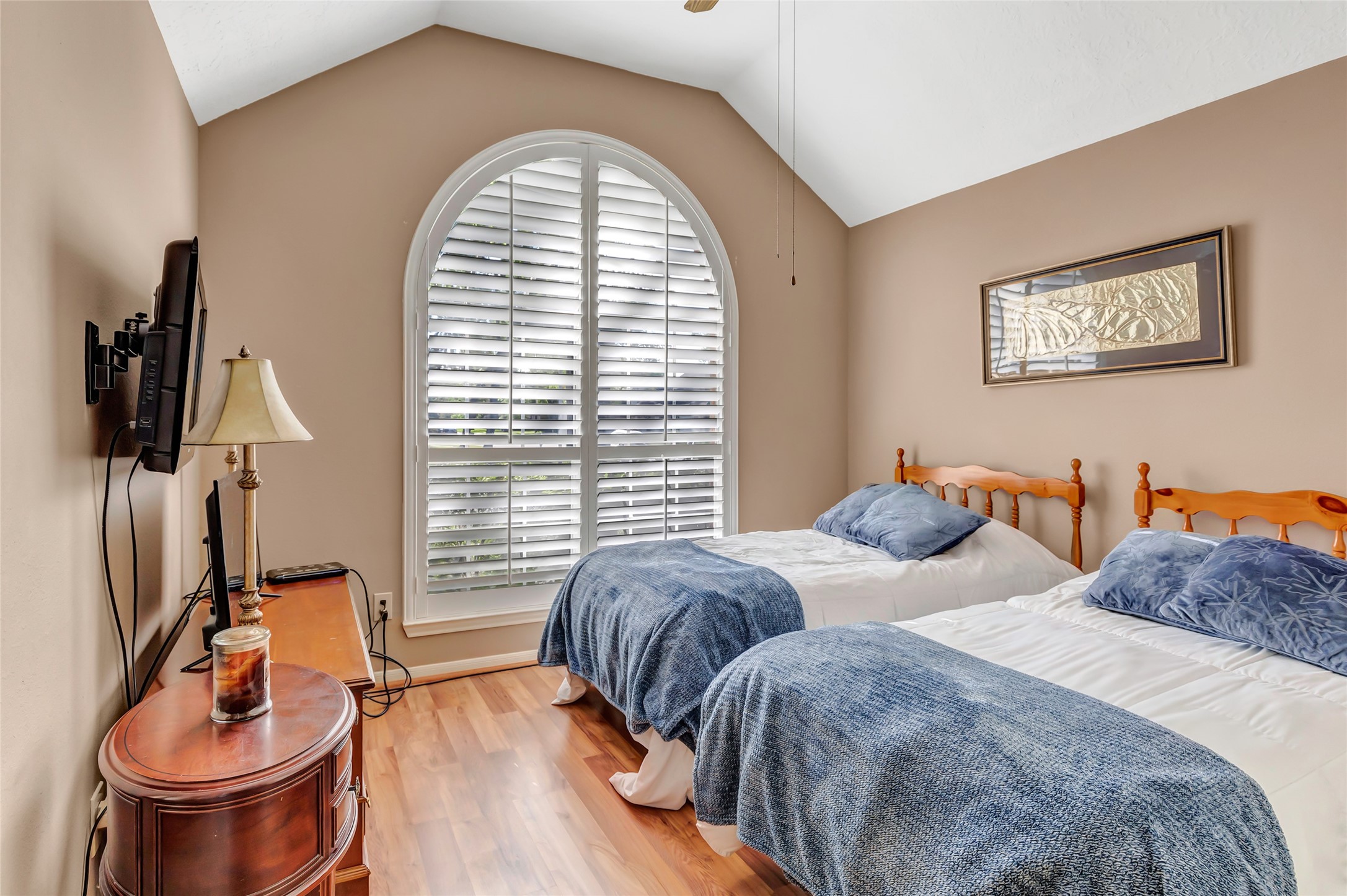 1014 North Rivershire Drive Conroe, TX 77304 - Photo 24 of 37 a bedroom with two beds and a wooden floor
