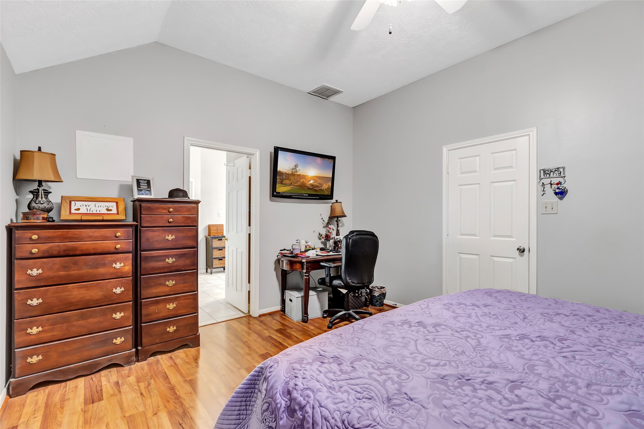 1014 North Rivershire Drive Conroe, TX 77304 - Photo 35 of 37 a bedroom with a bed and wooden floor