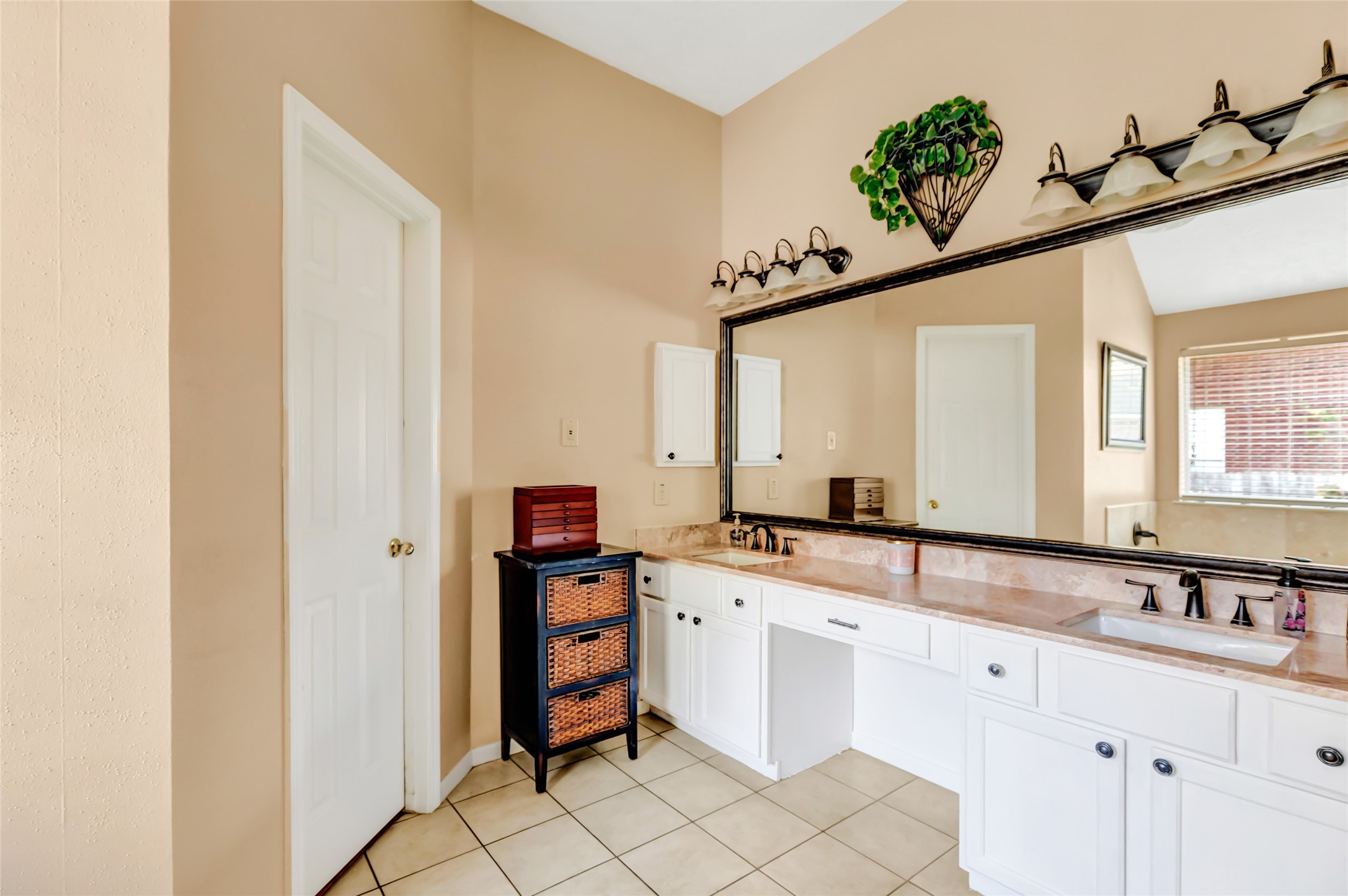 1014 North Rivershire Drive Conroe, TX 77304 - Photo 36 of 37 a spacious bathroom with a sink and a mirror