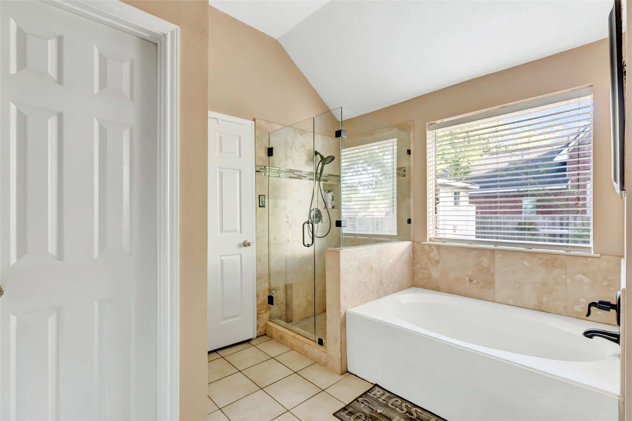 1014 North Rivershire Drive Conroe, TX 77304 - Photo 37 of 37 a bathroom with a bathtub and a shower