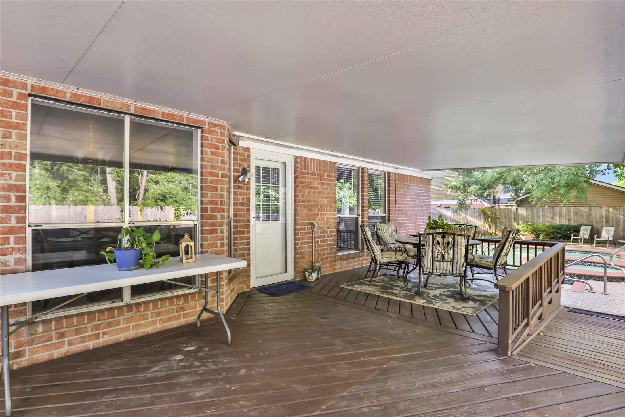 1014 North Rivershire Drive Conroe, TX 77304 - Photo 7 of 37 a balcony with furniture and wooden floor