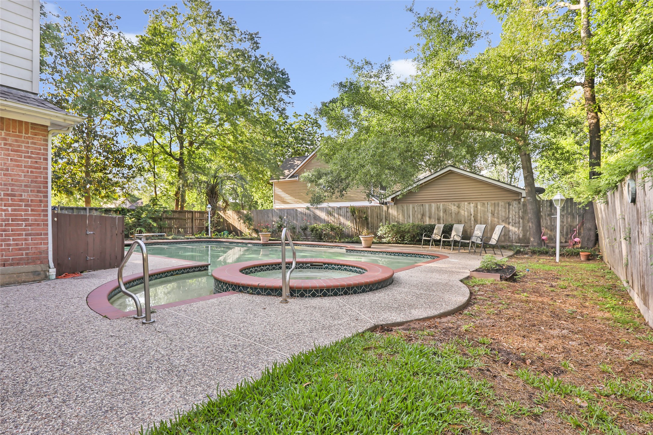 1014 North Rivershire Drive Conroe, TX 77304 - Photo 9 of 37 a front view of a house with a yard