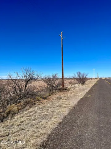 a view of a backyard of the house